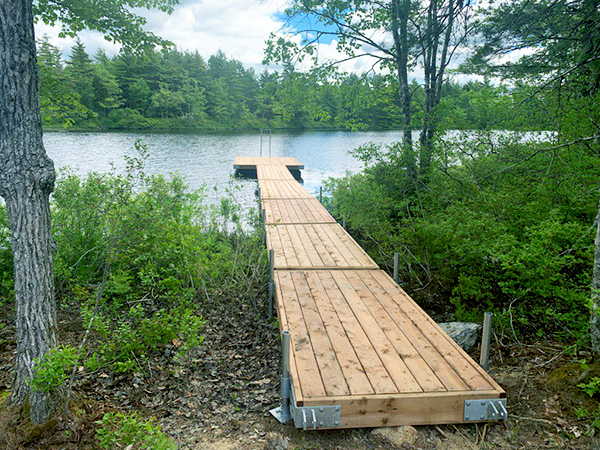 A wooden dock stretching out towards the waterfront.